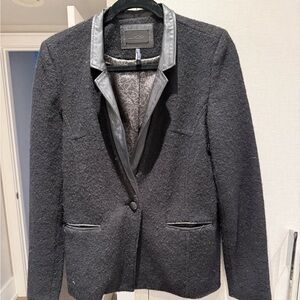 Wool Blazer with leather collar and leather trim on the pockets.